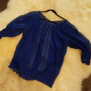 A beautiful colbalt blue sheer and lace blouse